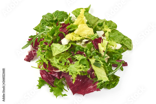 Salad mix with rucola, frisee, radicchio and lamb's lettuce, close-up, isolated on white background.