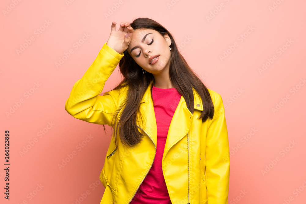 Teenager girl over pink wall with tired and sick expression Teenager girl over pink wall with tired and sick expression