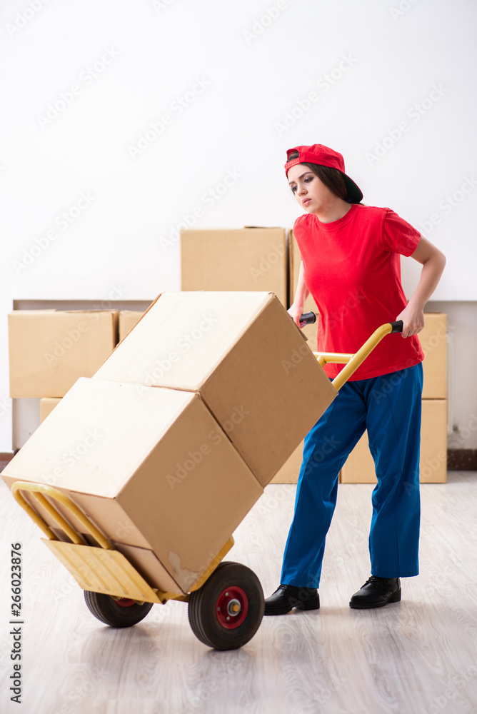 Young female professional mover doing home relocation Young female professional mover doing home relocation