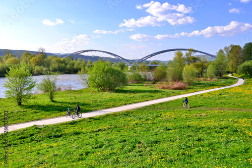 Healthy lifestyle - people riding bicycles in the city park along the river, Nowy Sacz, Poland