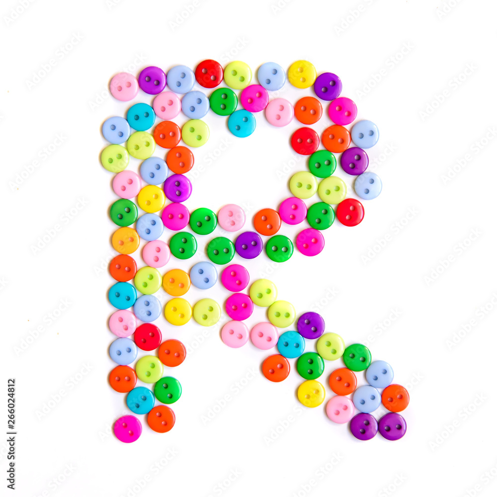 Letter R of the English alphabet made of multi-colored buttons