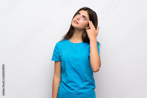 Bild auf Leinwand Teenager girl with blue shirt with problems making suicide gesture