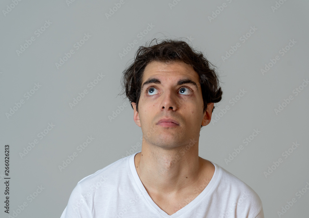 Young attractive latin young man thinking in new ideas and planing future Young attractive latin young man thinking in new ideas and planing future