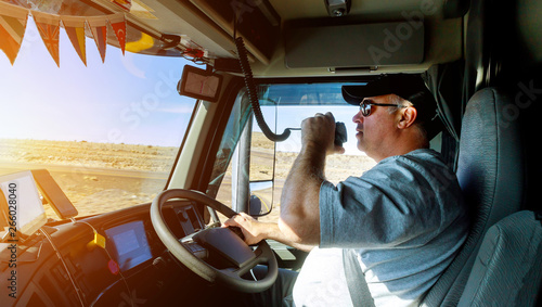 Truck drivers big truck right traffic hands holding radio and steering wheel