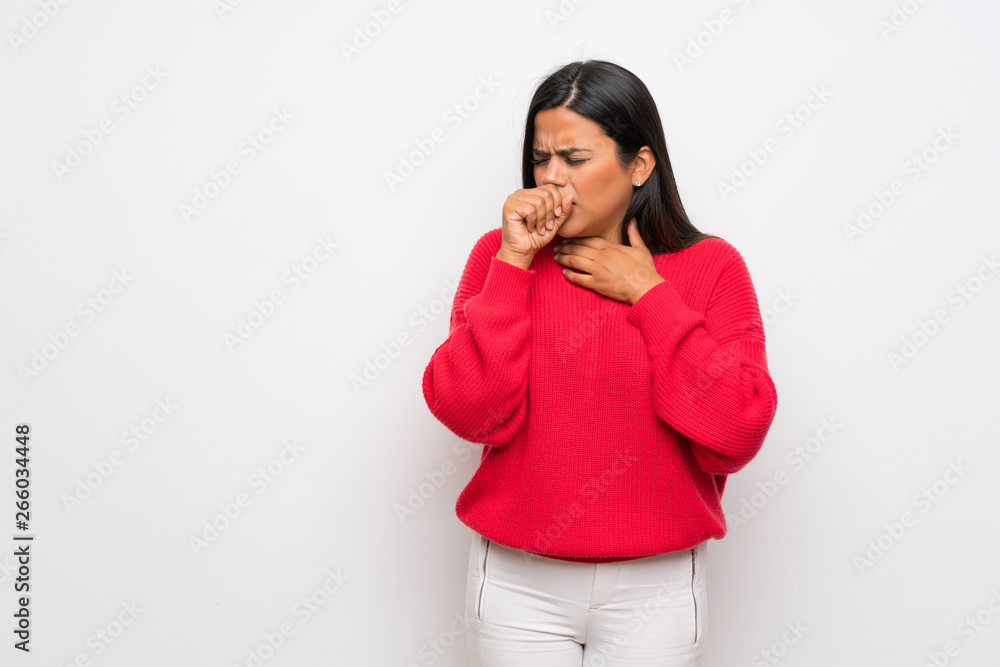 Young Colombian girl with red sweater is suffering with cough and feeling bad Young Colombian girl with red sweater is suffering with cough and feeling bad
