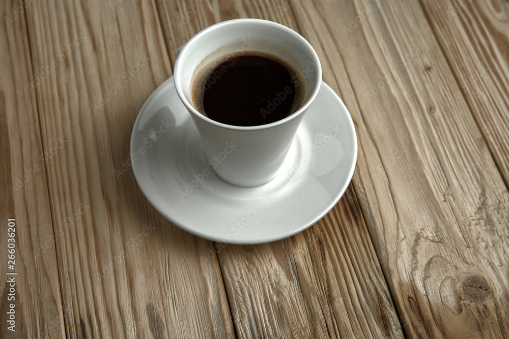 Hot coffee on a wooden stand, top view Hot coffee on a wooden stand, top view