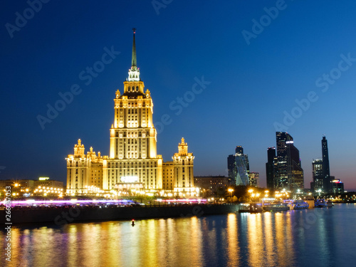 Moscow, Russia - 30 April 2019. Illuminated facade of The Hotel Ukraina, Radisson Collection hotel, one of seven stalinism skyscrapers also known as Seven Sisters