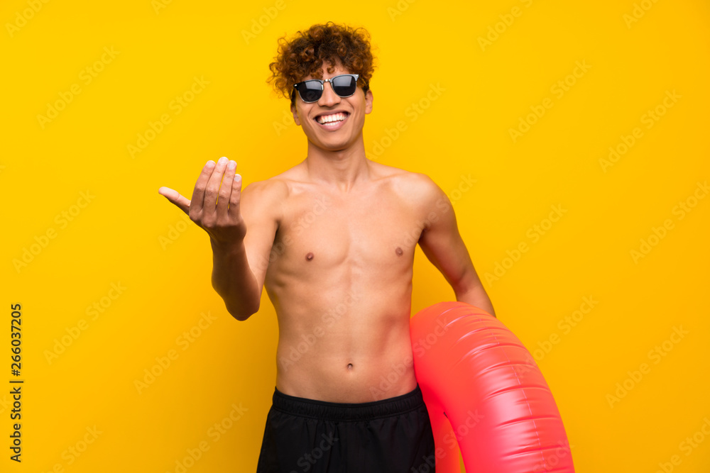 African american man over isolated purple wall inviting to come African american man over isolated purple wall inviting to come