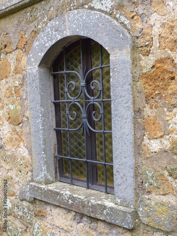 A medieval window in a Tuscan hill town village.