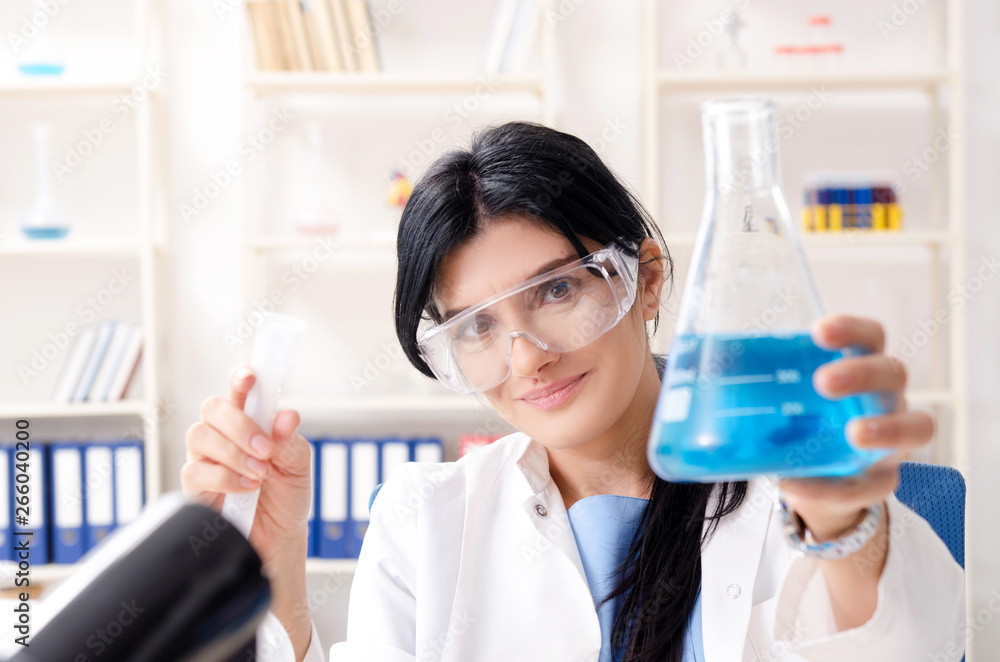 Female chemist working at the lab Female chemist working at the lab