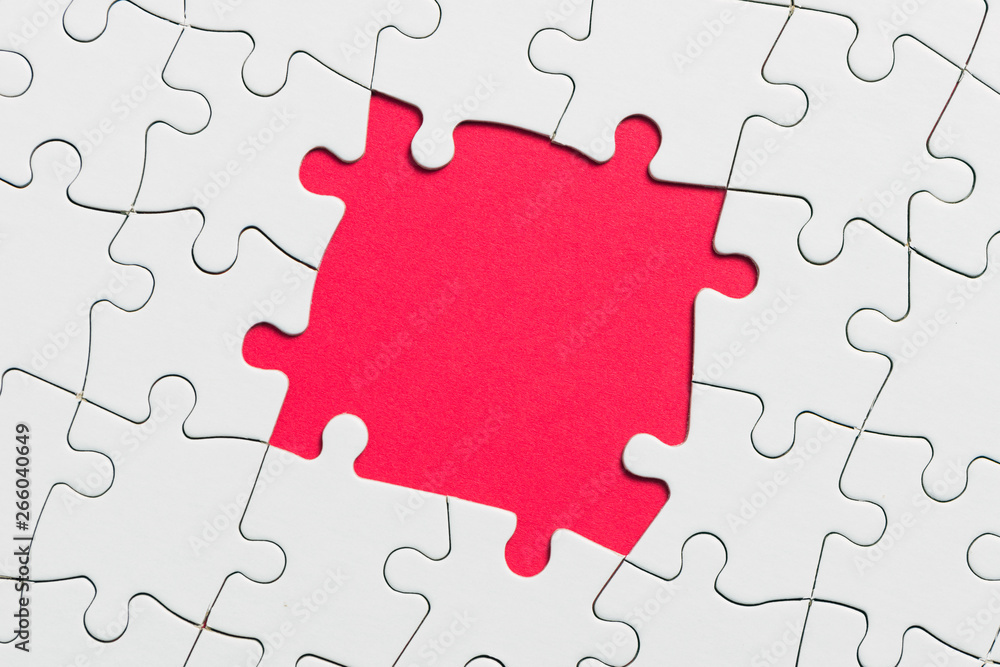 Jigsaw puzzle game piece on red background for business theme design Jigsaw puzzle game piece on red background for business theme design