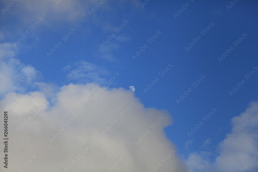 moon in the sky behind the clouds moon in the sky behind the clouds