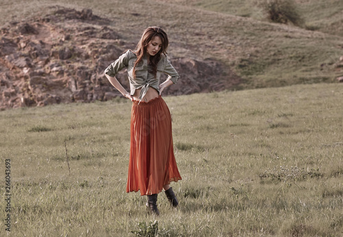 High fashion portrait of young beautiful woman model in stylish trendy clothes. Pretty woman posing outside.