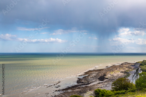 A view out to sea from near Eastbourne in Sussex  with a rain storm on the horizon