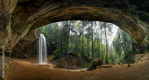 Slika na platnu Wonders in the Woods Panorama - Located in the Hocking Hills of Ohio, Ash Cave is an enormous sandstone recess cave adorned with a beautiful plunging waterfall