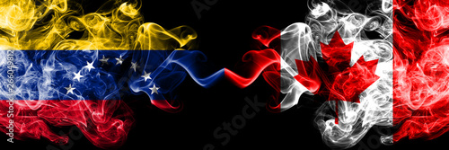 Venezuela vs Canada  Canadian smoky mystic flags placed side by side. Thick colored silky smoke flags of Venezuela and Canada  Canadian