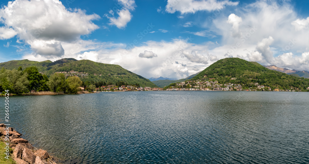 Panoramic view of Lake Lugano with Swiss Alps in Lavena Ponte Tresa, province of Varese, Italy