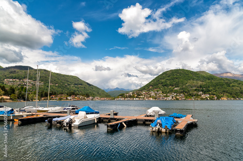 Landscape of lake Lugano and Swiss Alps in Lavena Ponte Tresa, province of Varese, Italy