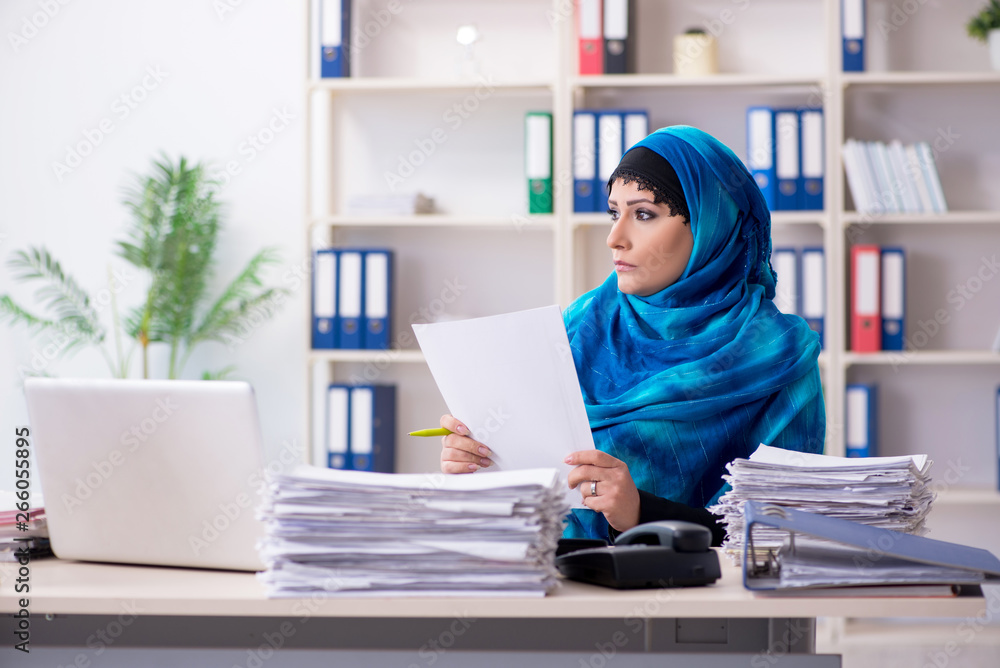 Female employee in hijab working in the office Female employee in hijab working in the office