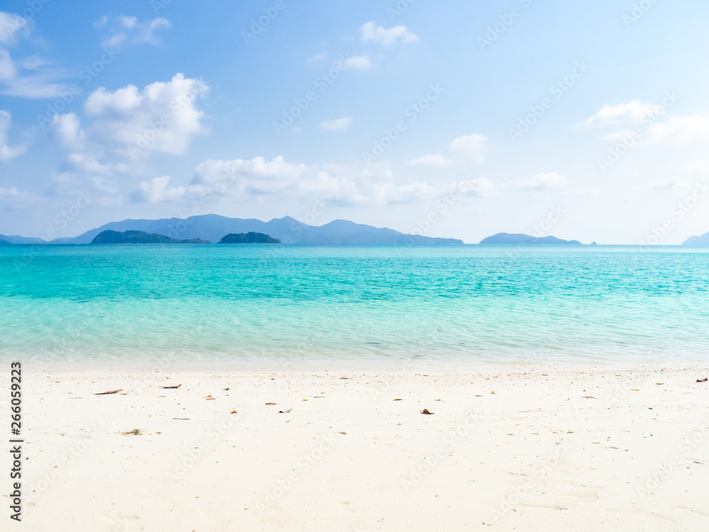 summer calm beach concept from beautiful of tropical sea with clean sky and blue water, white sand, soft focus background