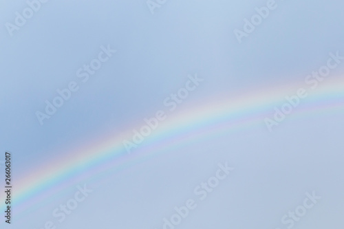 view on rainbow in a blue sky