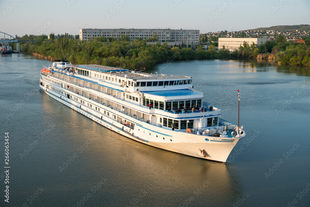 Cruise liner with tourists passes through the Volga-Don Shipping Canal named after Lenin. Volgograd. Russia.