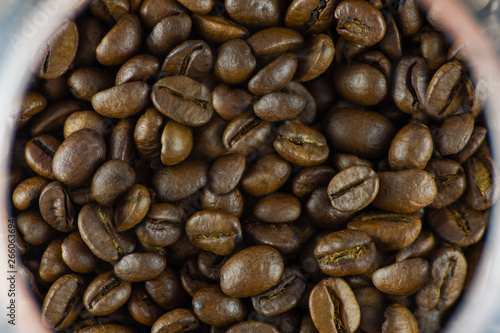 Close-up view of coffee beans in a glass glass glass. Horizontal photography