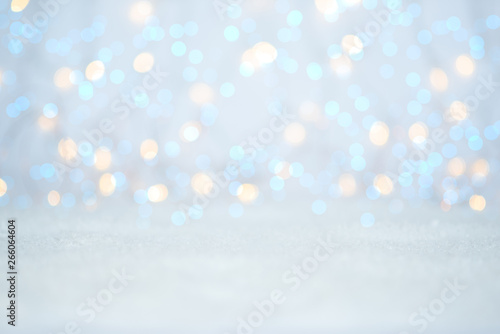 Christmas light background. Holiday glowing backdrop. Defocused Background With Blinking stars. Blurred bokeh.