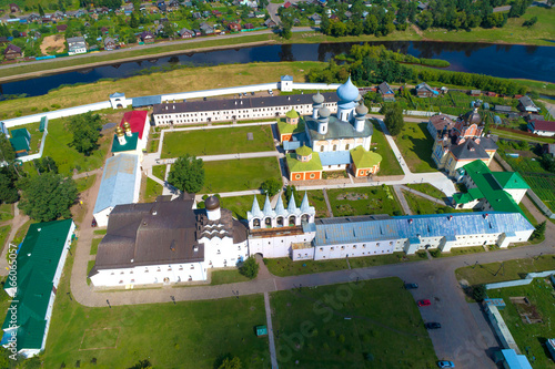 A view from the height of the temples of the Tikhvin Assumption Monastery on a July afternoon (aerial photography). Tikhvin, Russia