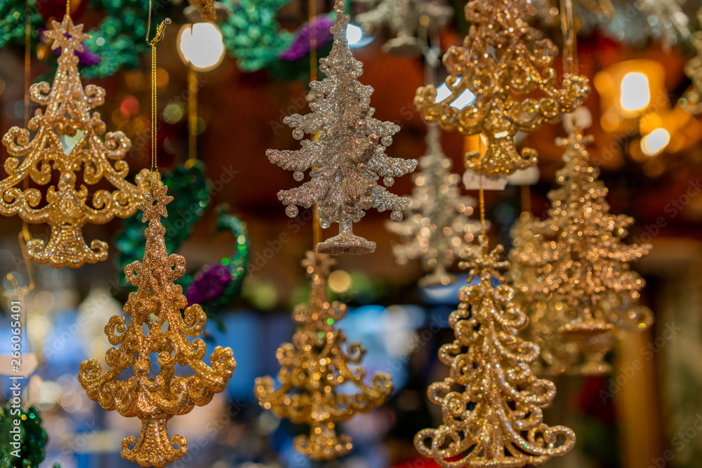 Fototapeta premium Christmas decorations displayed for sale at a Christmas Market at in Munich, Germany. Decoration products hanging at street stall.