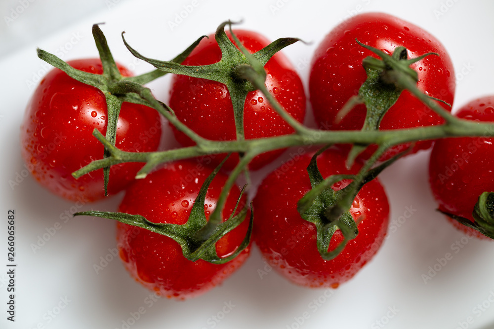 Cherry tomatoes on white background close up Cherry tomatoes on white background close up