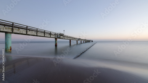 Long exposure of a sea bridge at the Baltic Sea on the island of Usedom at sunrise © Thomas