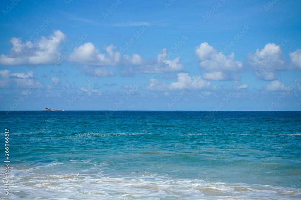 Clouds blue sky and calm sea background landscape