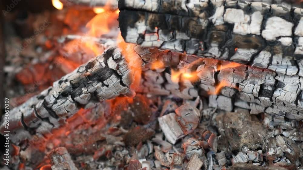 the flames in the campfire coals hot and the smoke the flames in the campfire coals hot and the smoke