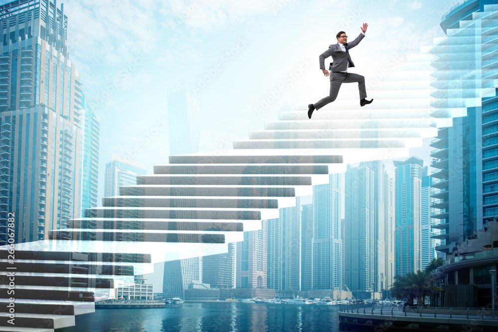 Businessman climbing career ladder over city Businessman climbing career ladder over city