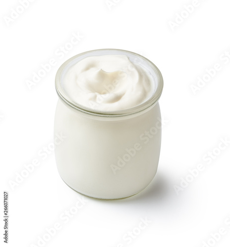 Fresh natural homemade organic yogurt in a glass jar isolated on white background