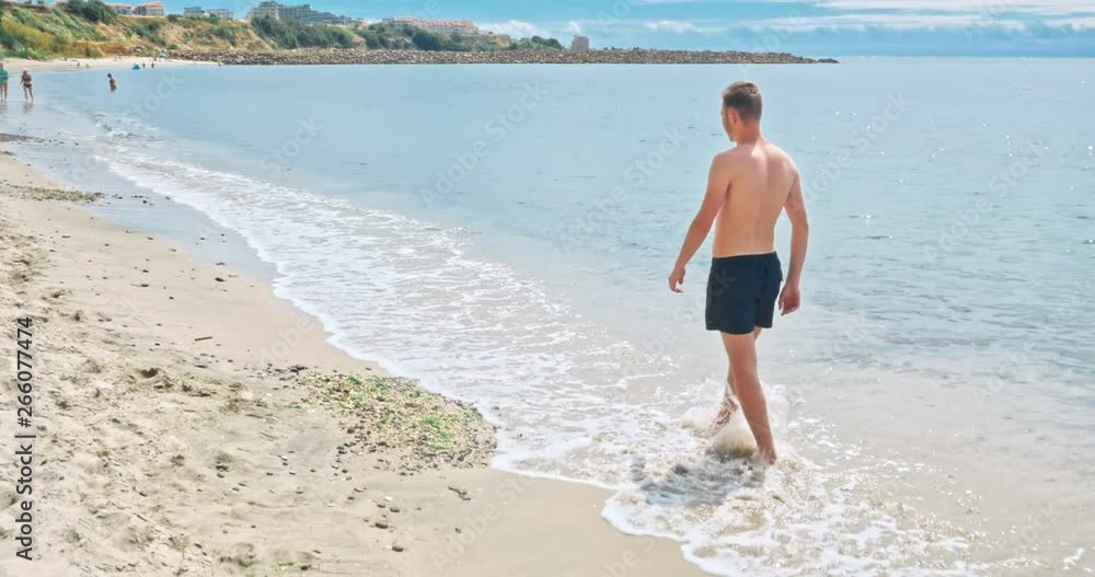 Jogging on a tropical sandy beach near sea Jogging on a tropical sandy beach near sea