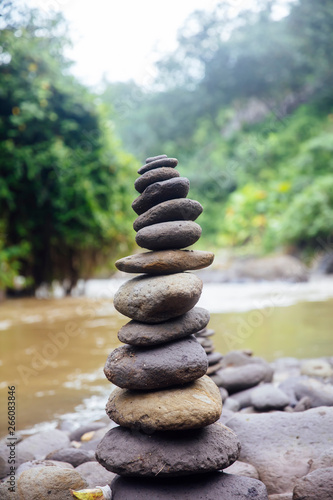Stacked zen stones at Tegenungan Waterfall at Bali  Indonesia