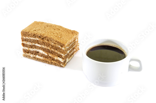 piece of cake and a cup of coffee on a white background