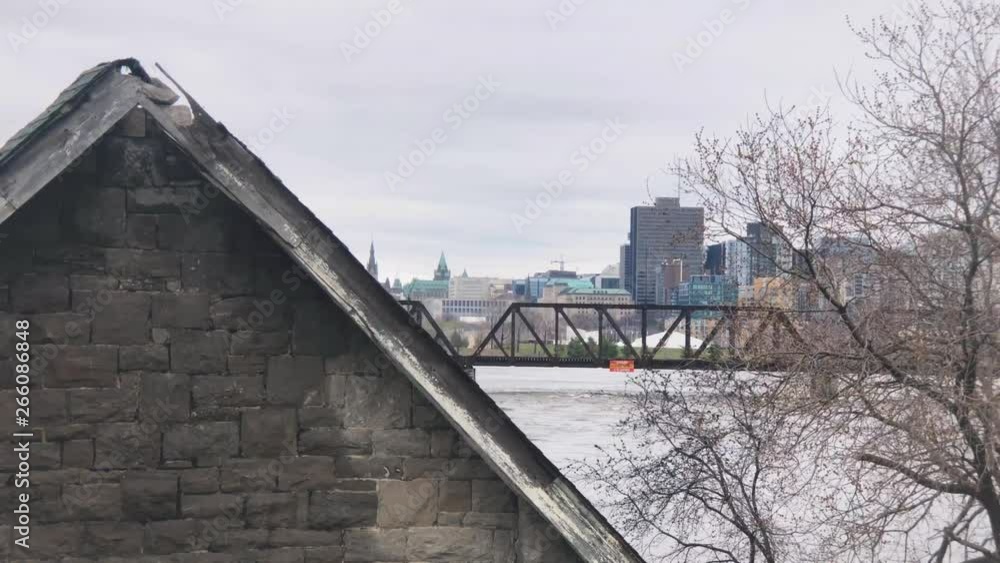 Slow motion pan from behind destroyed home on Ottawa River during 2019 flood. Slow motion pan from behind destroyed home on Ottawa River during 2019 flood.