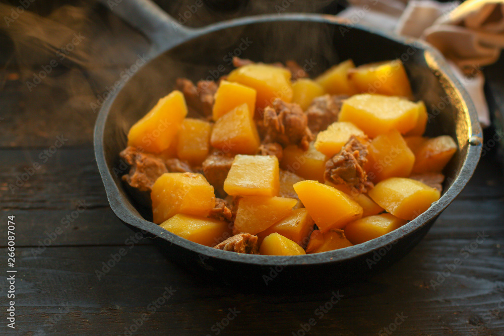 goulash, stewed potatoes with meat. stewed main course. food background. top goulash, stewed potatoes with meat. stewed main course. food background. top