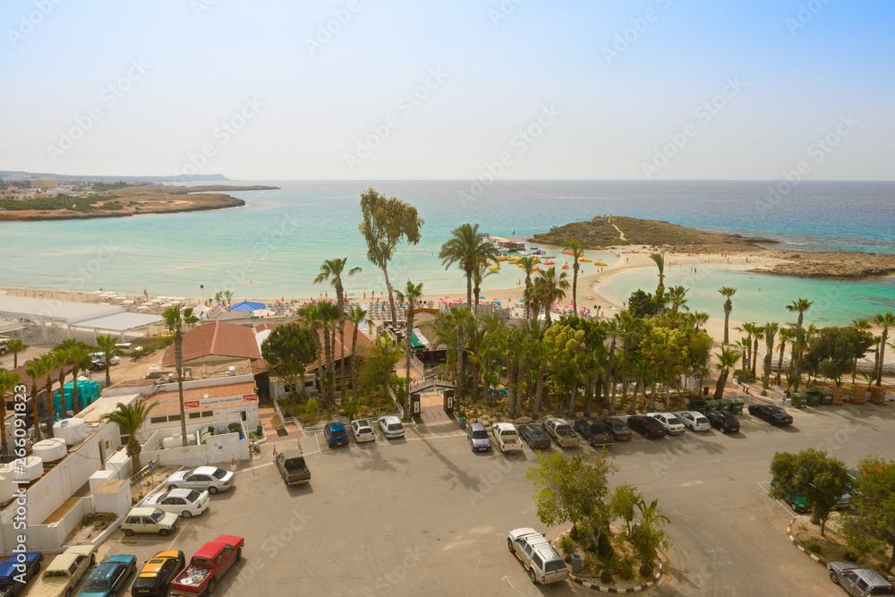 May 2, 2014: The Mediterranean coast with equipped beach and parking on the island of Cyprus. Ayia Napa. Cyprus. May 2, 2014: The Mediterranean coast with equipped beach and parking on the island of Cyprus. Ayia Napa. Cyprus.