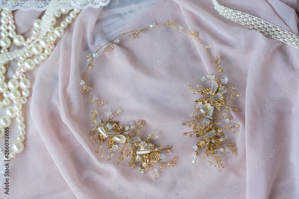 Wedding background with pearls and hair accessories on pink background Wedding background with pearls and hair accessories on pink background