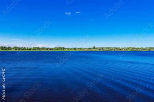 view of the kama river on a cloudless summer day photo