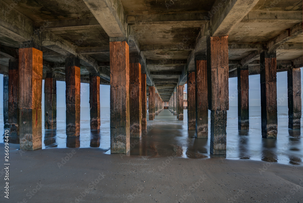 Pillars in the sea water under the Pier of Blankenberge, Belgium