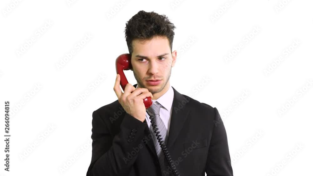 Angry businessman shouting on the phone isolated on white Angry businessman shouting on the phone isolated on white