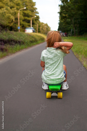 Little girl on a skateboard