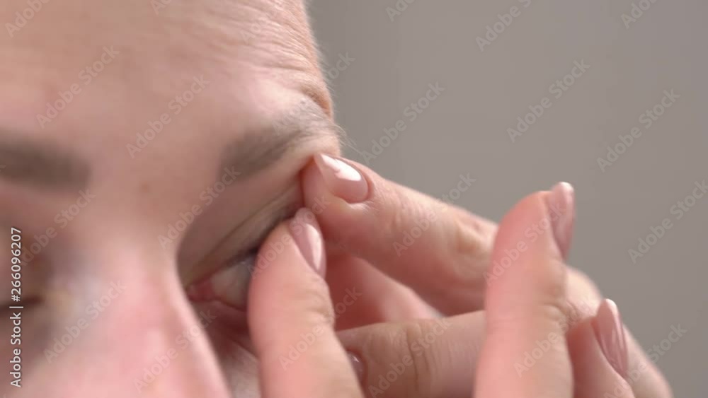 Female putting contact lens in her eye. Ophthalmology and vision. Close-up demonstration video Female putting contact lens in her eye. Ophthalmology and vision. Close-up demonstration video
