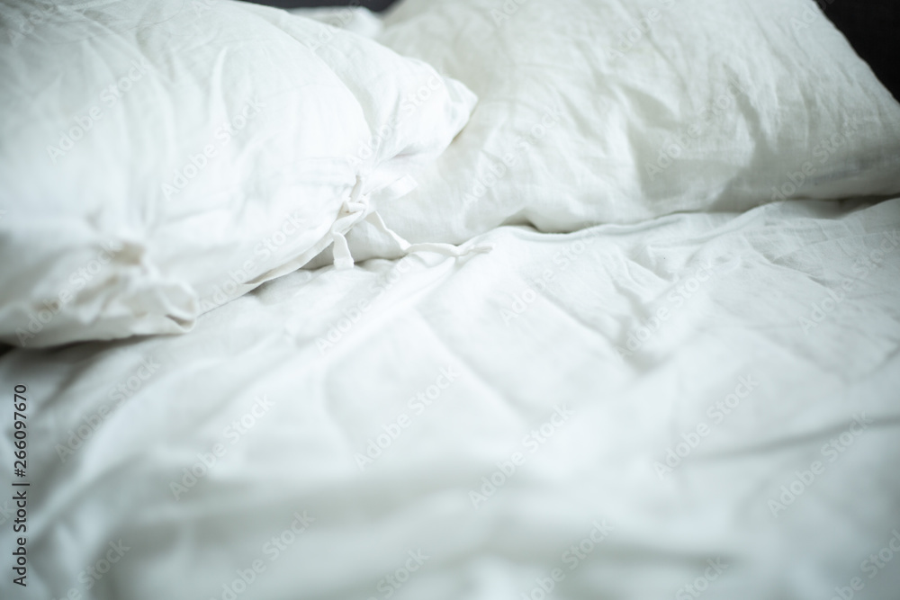 white linen pillows on bed white linen pillows on bed
