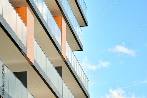 Apartment building with blue sky and clouds